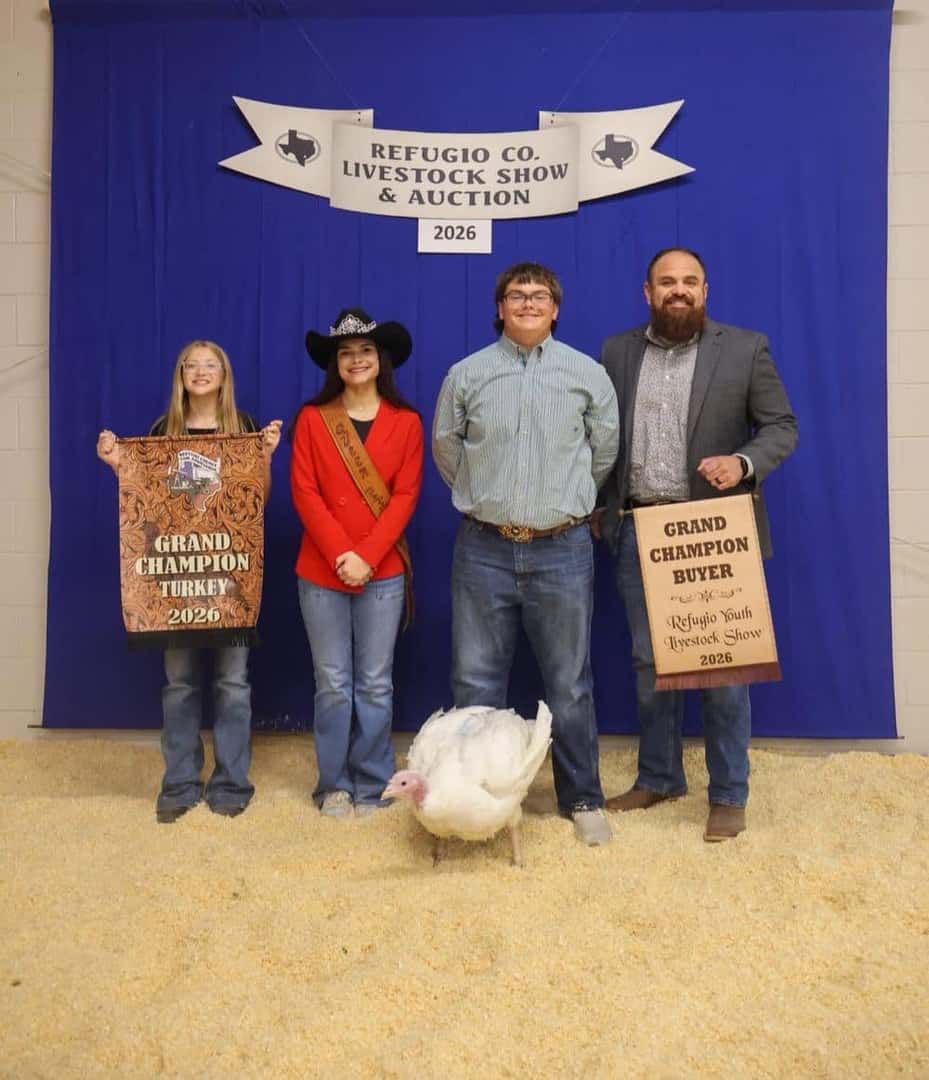 Allen Samuels team members with grand champion buyers at the Refugio County Livestock Show and Auction
