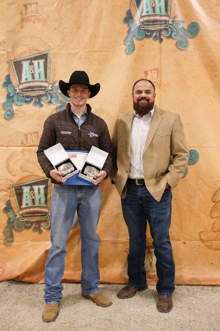 Allen Samuels representative with a youth rodeo award winner