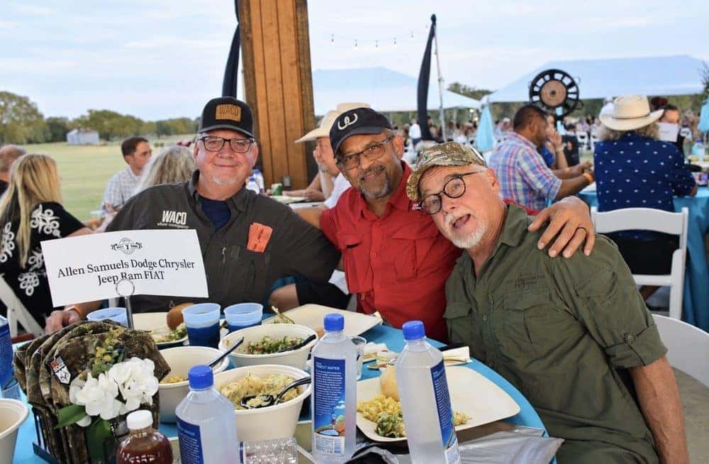 Allen Samuels Waco team members at a community event table