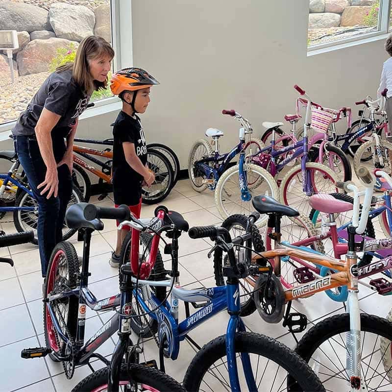 Volunteers unloading donated bikes from a truck