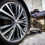 A close-up of an INFINITI tire on a vehicle