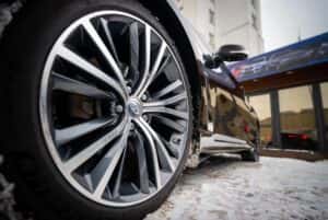 A close-up of an INFINITI tire on a vehicle