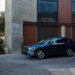 2026 Mazda CX-5 parked outside a modern building showing premium design