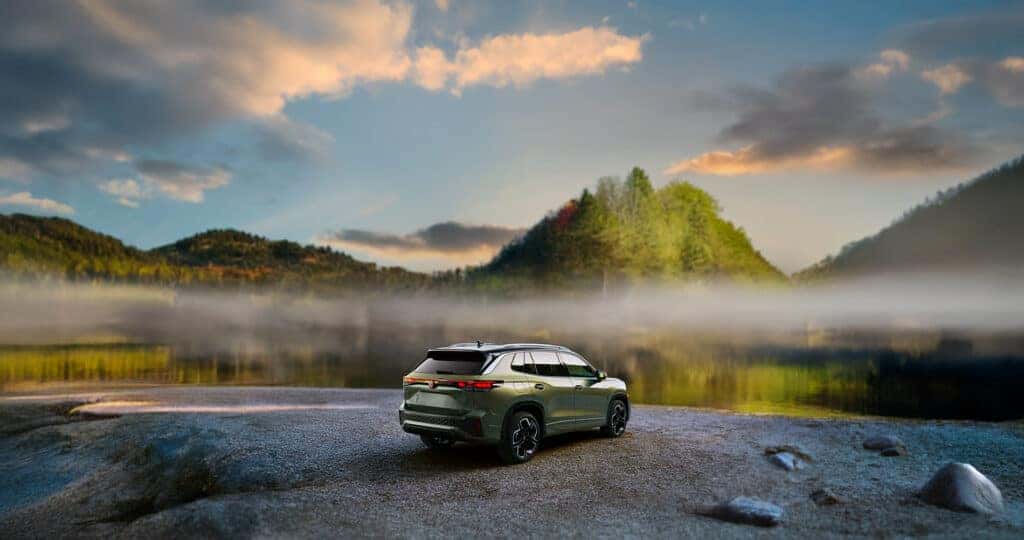 2025 Volkswagen Tiguan SEL R-Line parked by a foggy mountain lake at sunset