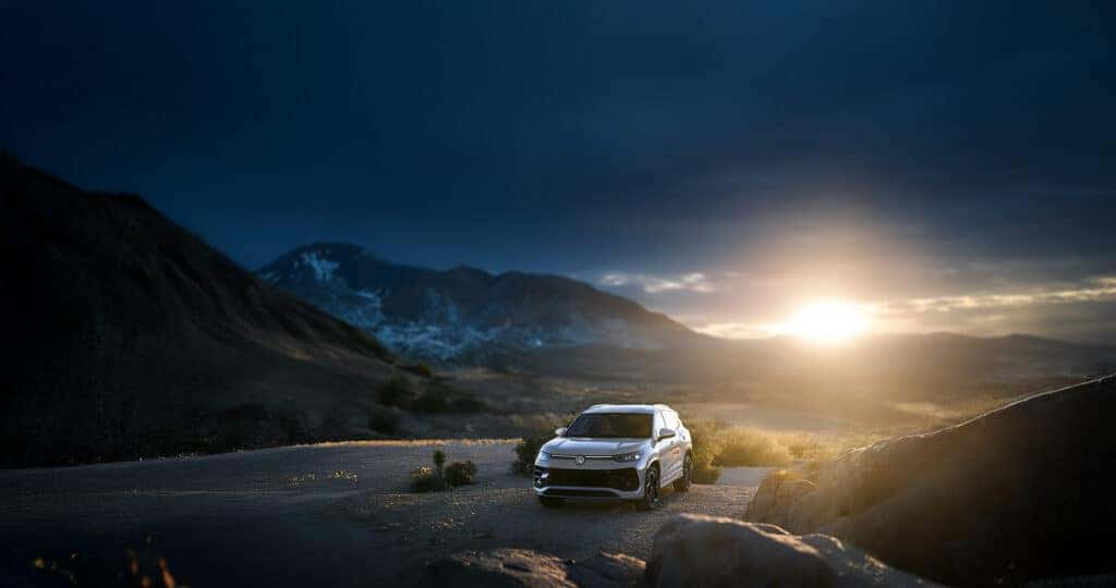 2025 Volkswagen Tiguan dimensions being compared to the desert landscape