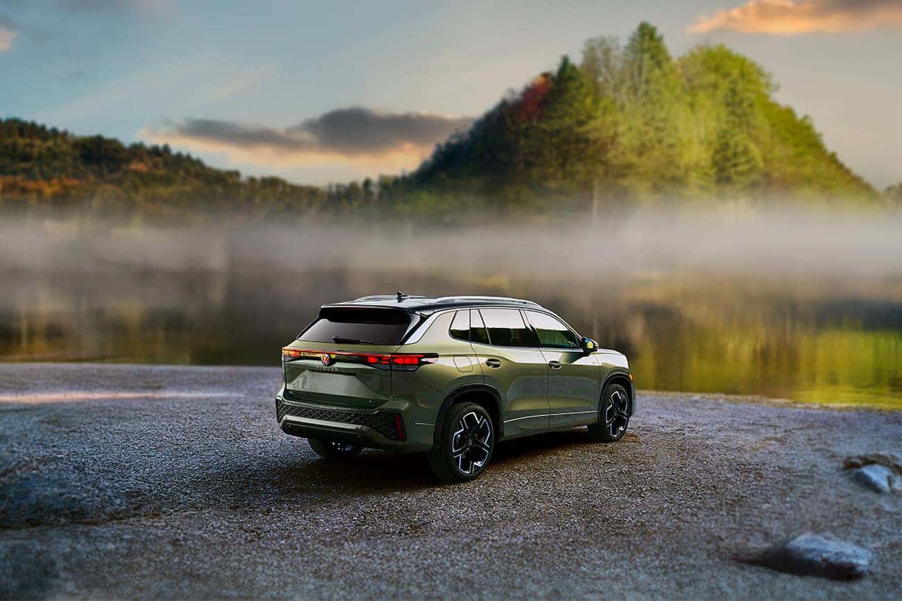 2025 Volkswagen Tiguan SEL R-Line parked by a foggy mountain lake at sunset