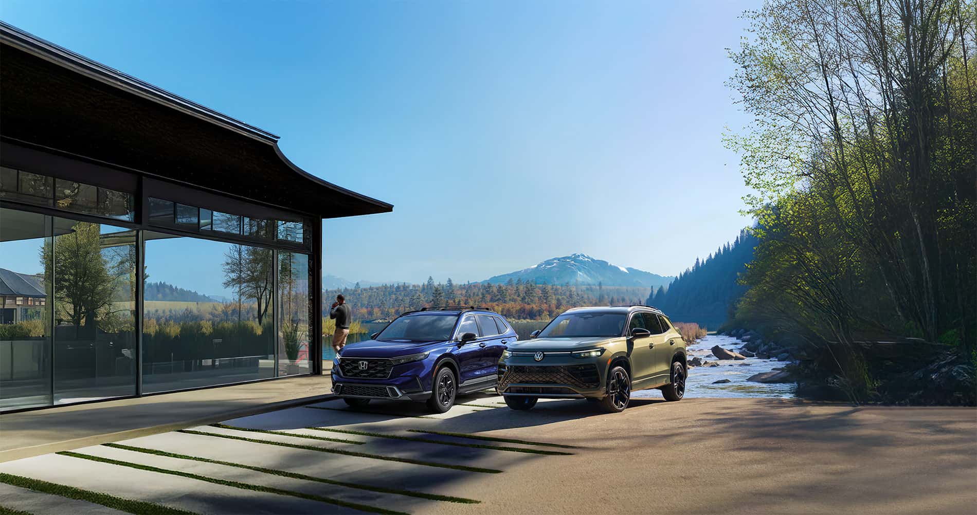 Tiguan vs CRV parked in front of a lakeside cabin in the mountains