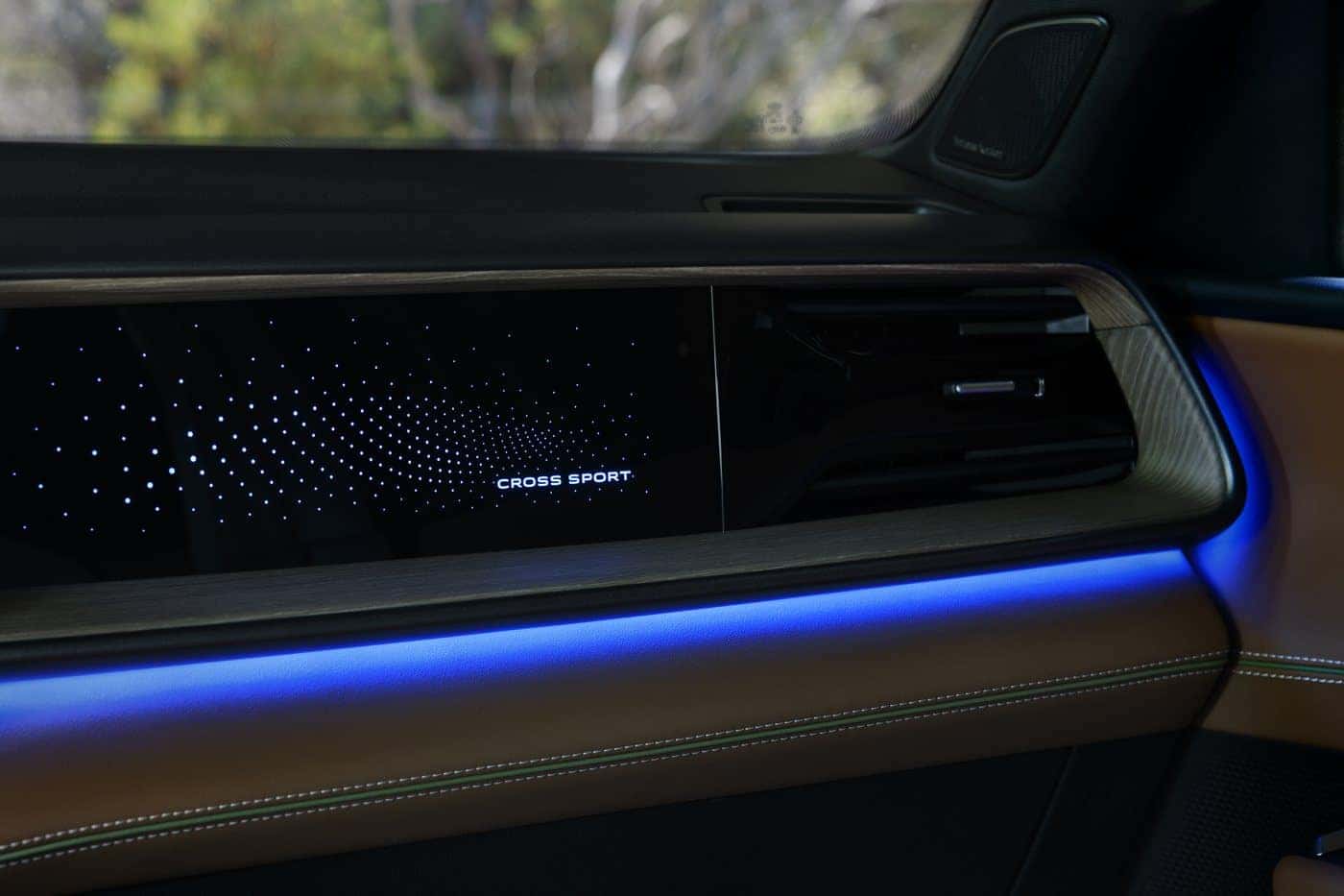 2027 Volkswagen Atlas Cross Sport ambient-lit dashboard with Cross Sport display