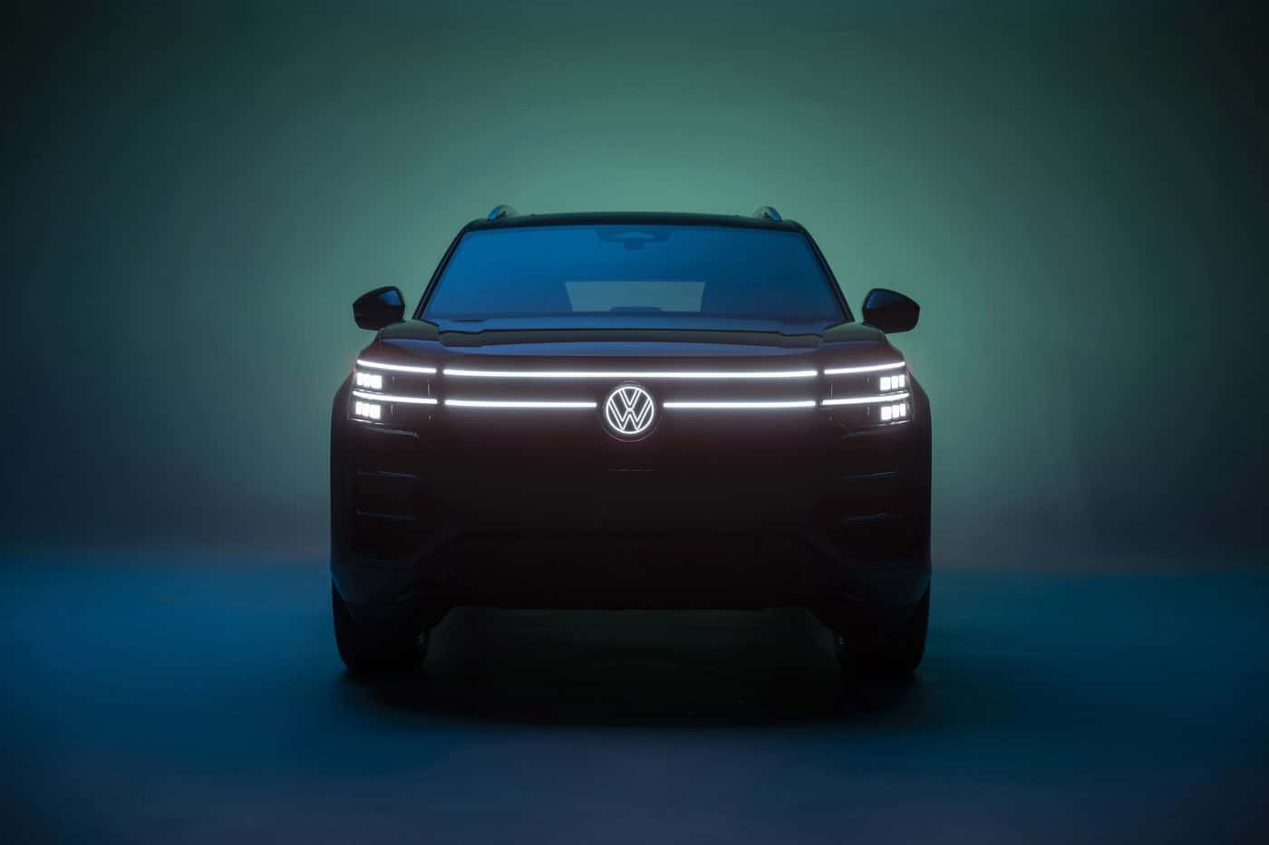 2027 Volkswagen Atlas R-Line front with full-width LED light bar and illuminated badge