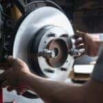 Mechanic working on a brake repair near Milwaukee