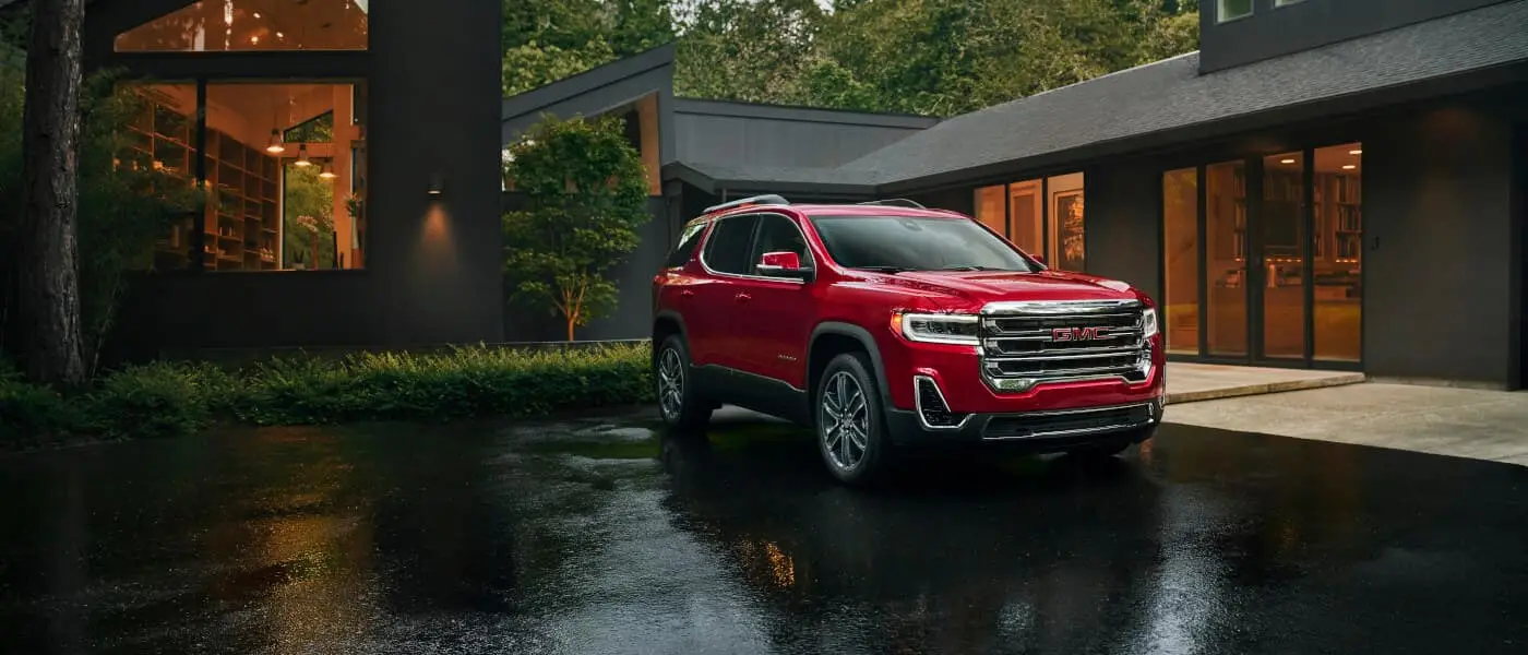 GMC Acadia parked outside a house