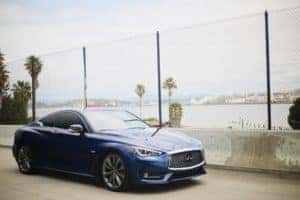 Blue INFINITI sedan parked