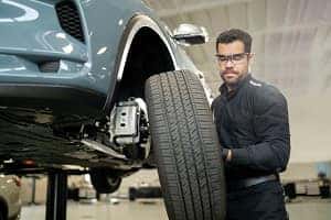 INFINITI SUV and sedan in service bay at Herrin-Gear INFINITI in Jackson, Mississippi
