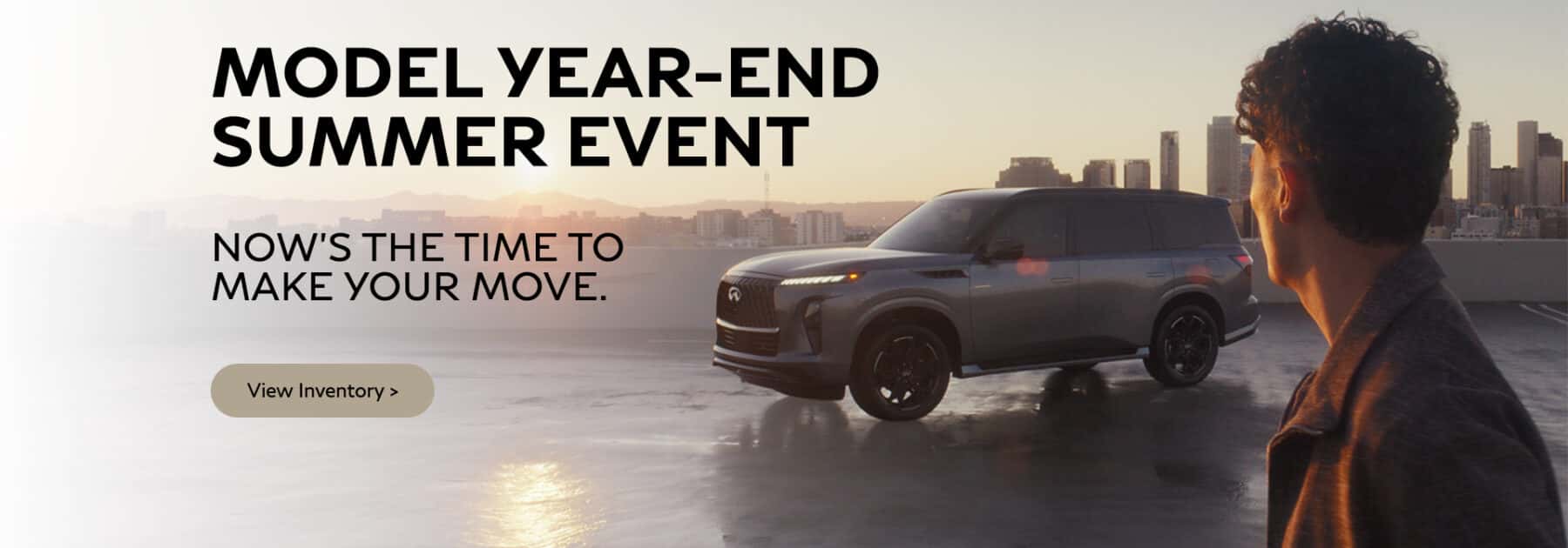 Image of young man standing near an SUV with the text Model Year End Sales Event