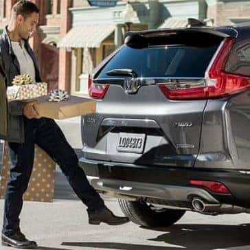 Couple-Loading-Presents-into-2019-Honda-CR-V-Cargo-Area