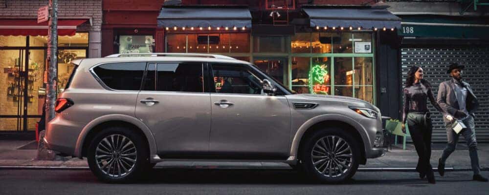 2021 INFINITI QX80 parked in front of city buildings
