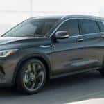 INFINITI QX50 driving down the road