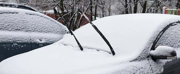 car outdoor in a winter morning with snow covered