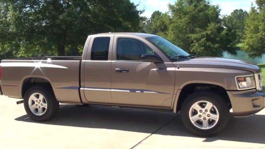 a picture of a 2010 Dodge Dakota sitting on a driveway in Edmond Oklahoma