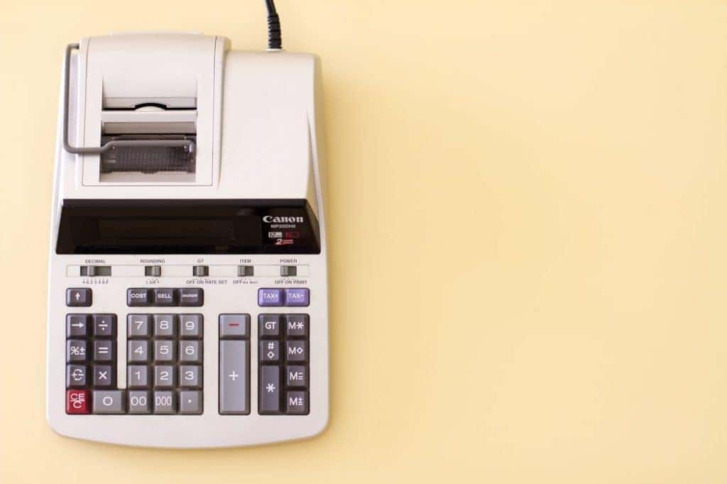 a calculator in front of a yellow background