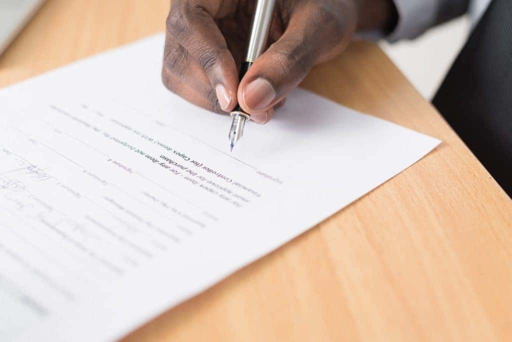 signing a purchase agreement at our edmond dealership