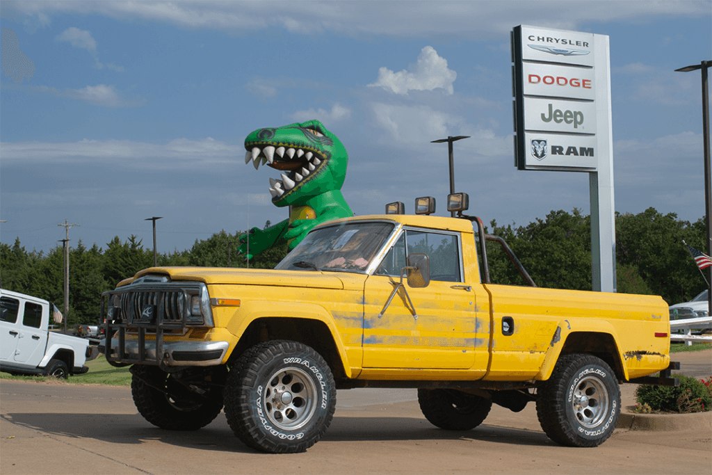 a jeep used in the filming of "Twister" the movie in front of John Vance Chrysler Dodge Jeep Ram in Guthrie, Oklahoma.