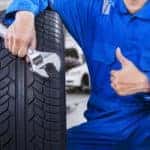 Male mechanic showing thumb up in workshop