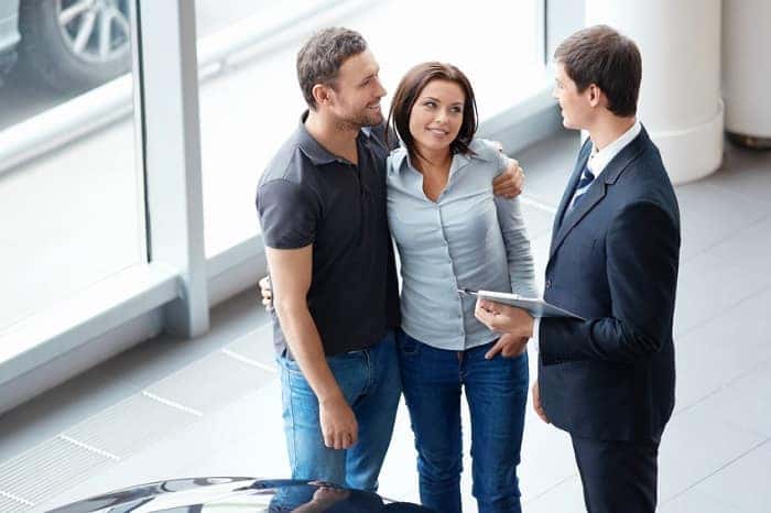 Couple Talking to Mercedes-Benz Dealer