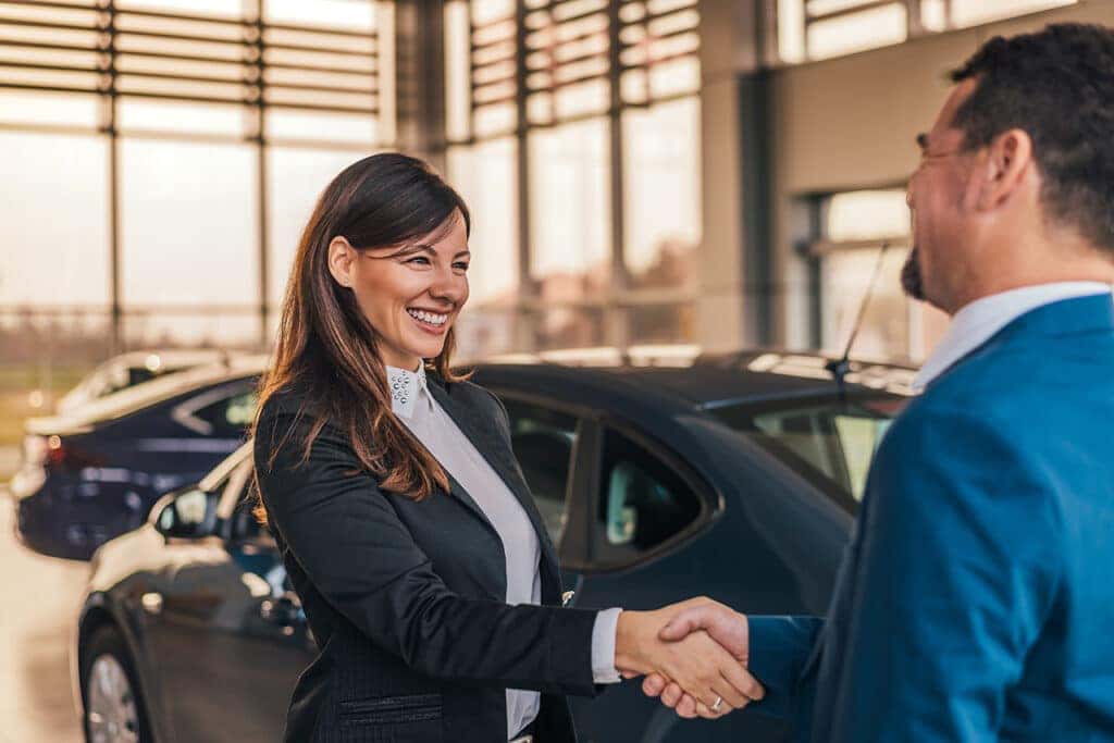 Customer and Car Dealer Shaking Hands