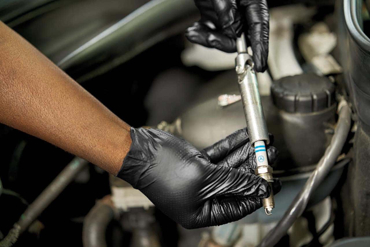 Technician installing Mercedes-Benz parts