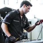 Changing oil as part of a Mercedes-Benz service schedule