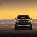 A pre-owned Mercedes-Benz vehicle parked at sunset