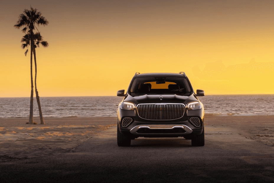 A pre-owned Mercedes-Benz vehicle parked at sunset