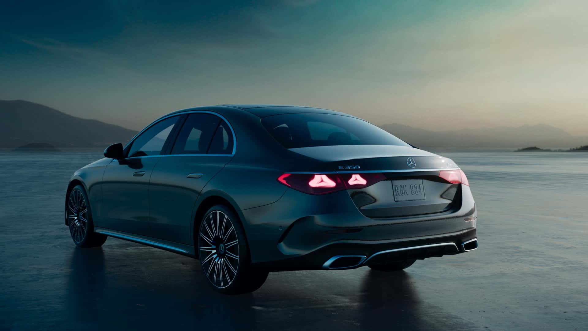 A Mercedes-Benz lease vehicle driving at dusk
