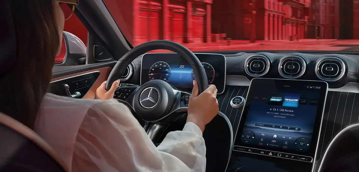 Driver in a vehicle equipped with Mercedes-Benz safety features
