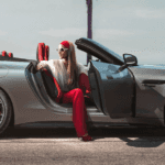 Woman stepping out of a 2026 Mercedes-AMG SL Roadster