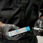 Technician holding new Mercedes-Benz parts