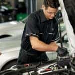 Technician working on Mercedes-Benz battery warranty service
