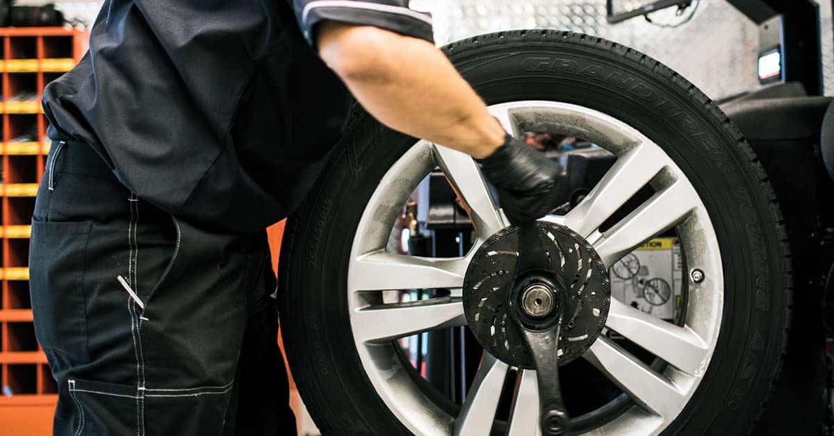 Technician installing new Mercedes-Benz tires