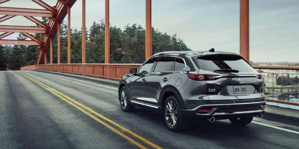 2022 Mazda CX-9 driving across a bridge.