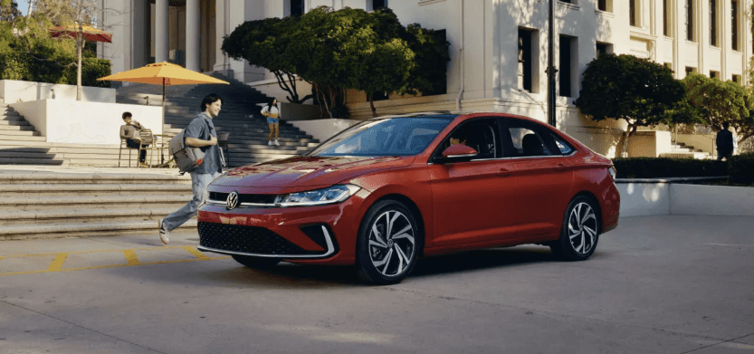 2026 Volkswagen Jetta parked outside a campus building