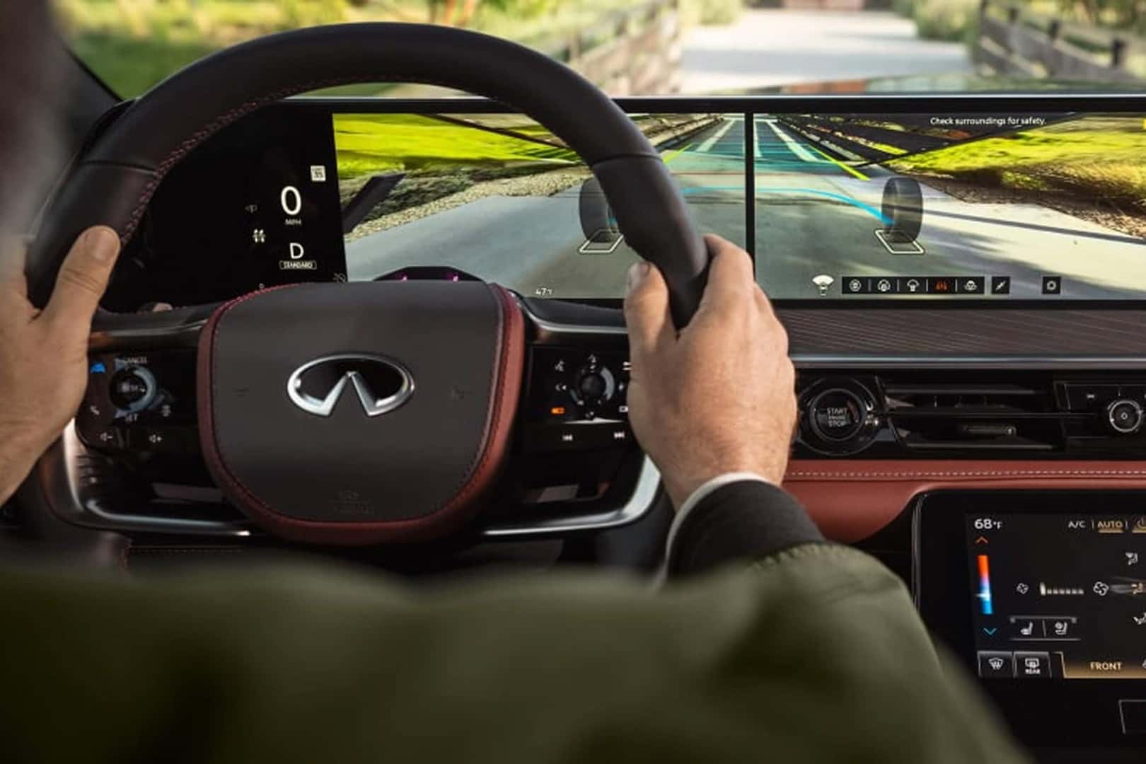 man driving qx80