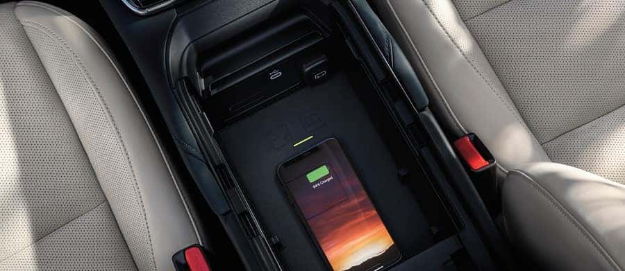  Charge compatible devices like your smartphone on the available wireless charging pad.