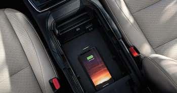  Charge compatible devices like your smartphone on the available wireless charging pad.