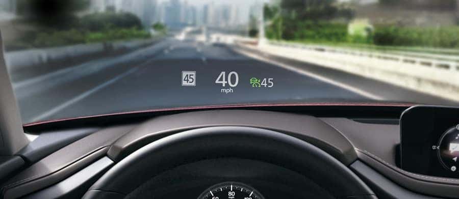 The available Active Driving Display helps you keep your eyes on the road by projecting relevant
                information on your windshield.