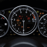 Different Mazda warning lights on the instrument cluster panel