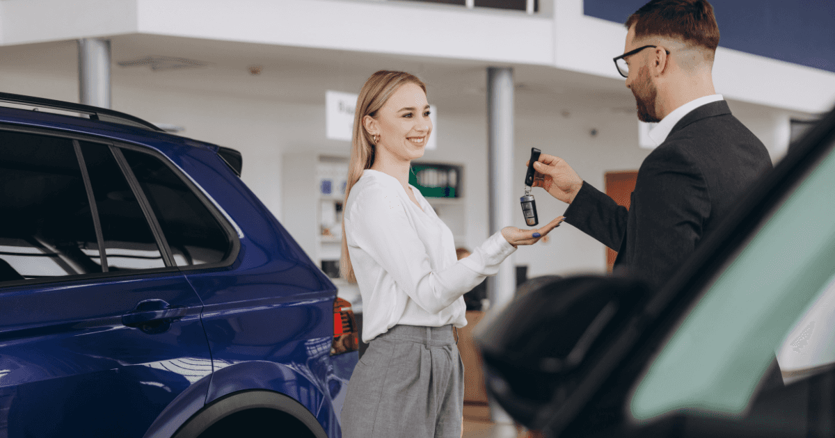 A young woman getting the keys to her next lease
