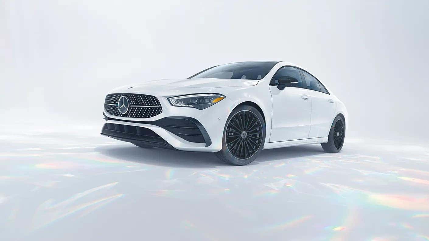 White Mercedes-Benz CLA parked on a pearl shine floor