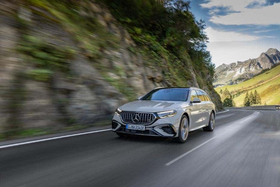 2026 AMG E 53 driving on a shaded mountain road