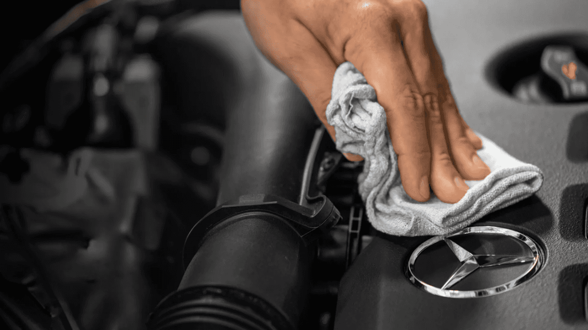 closeup of technician performing mercedes-benz routine maintenance 